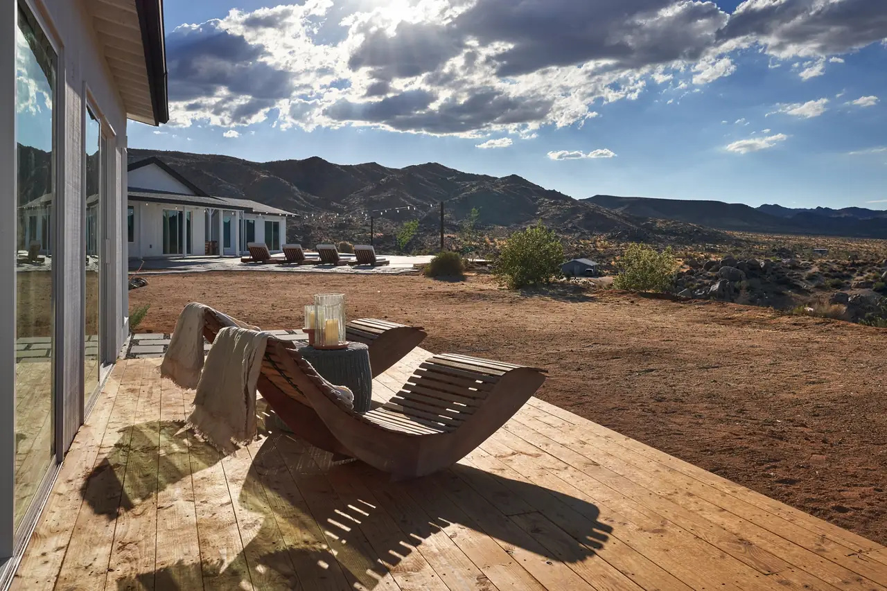 Wood deck with lounger and sweeping mountain views