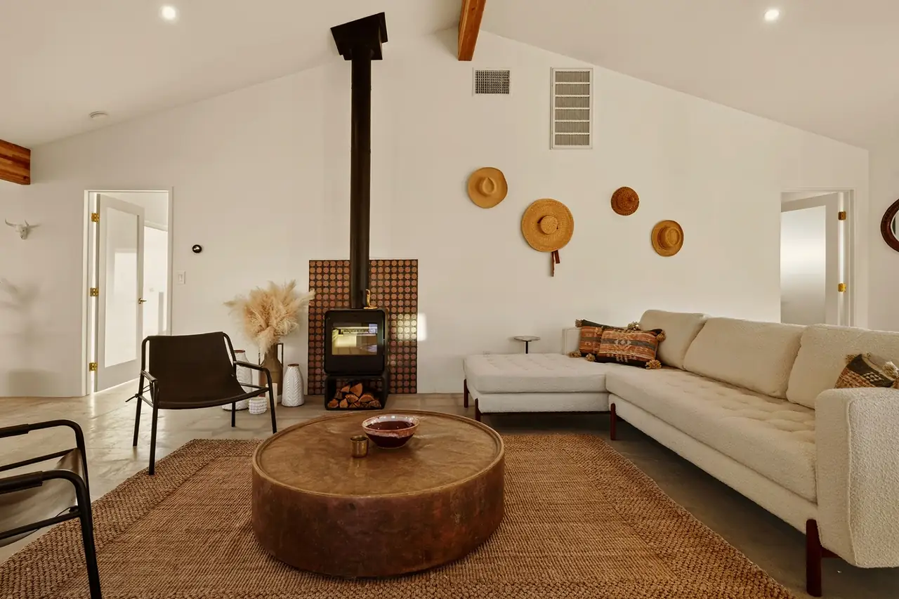 Living room lounge with wood stove and sectional